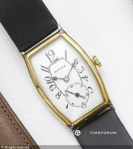 rolex-switzerland-a-tonneau-shaped-wristwatch-2266629.jpg