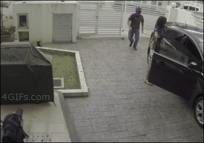 Girl-thwarts-robbery-CCTV.gif